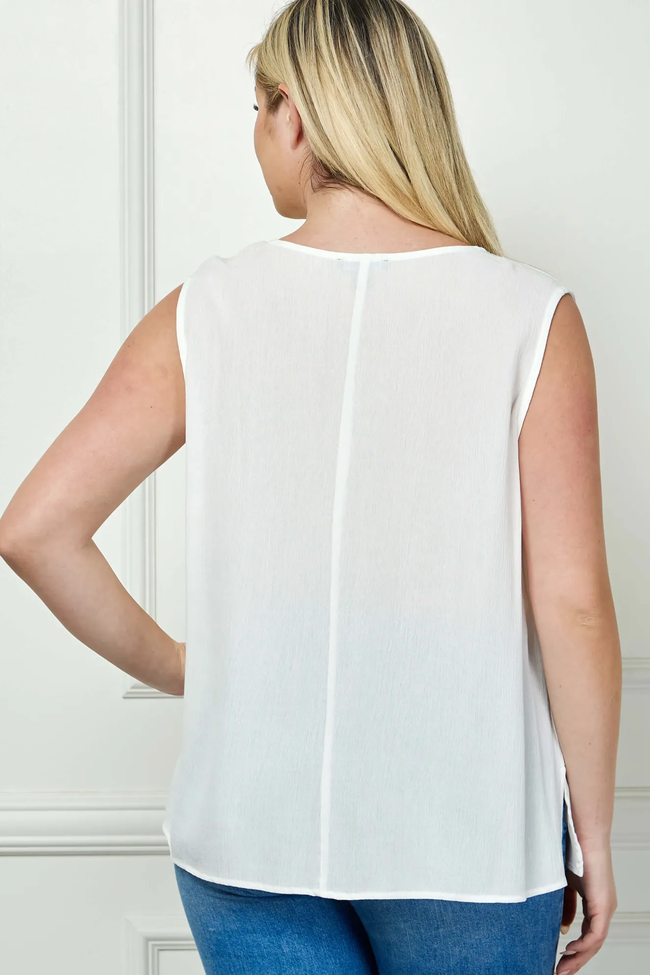 Sleeveless Embroidered Yoke Split Neck Blouse in White- Plus